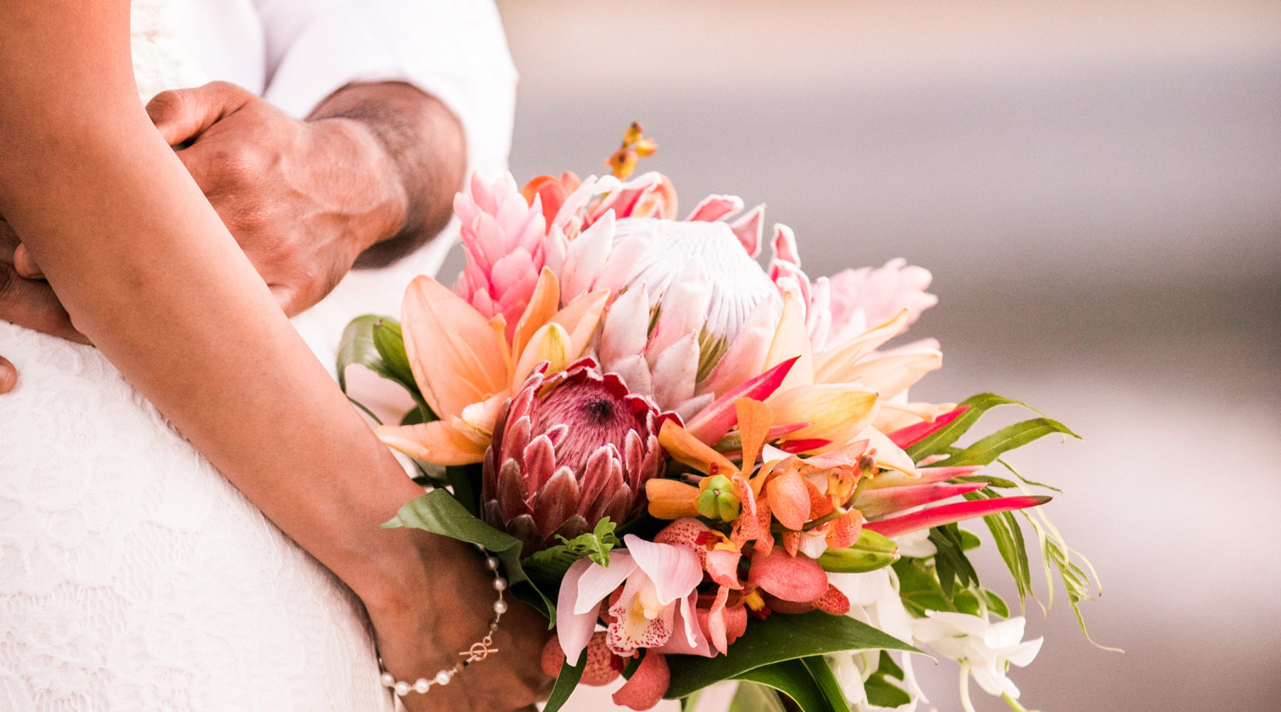 Elopement wedding bouquet on the beach in Hawaii.