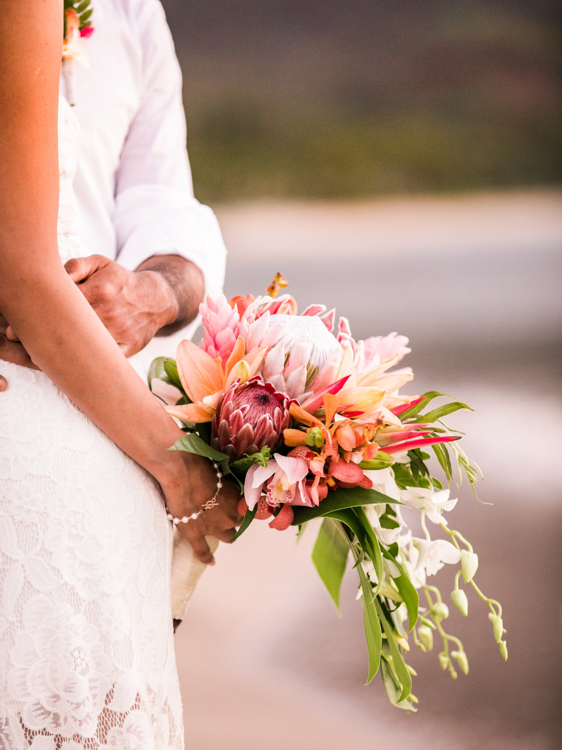 Elopement wedding bouquet on the beach in Hawaii.