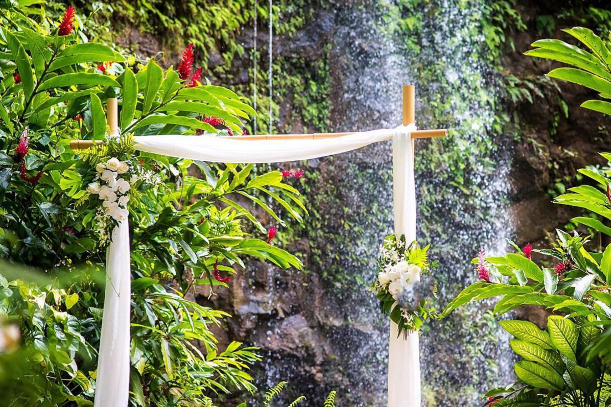 Bamboo arch at for waterfall wedding ceremony