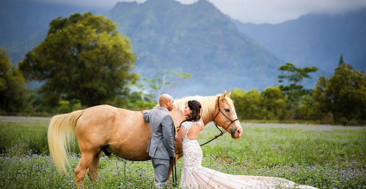 Bride and Groom with beautiful horse for a first look before their intimate Kauai wedding ceremony