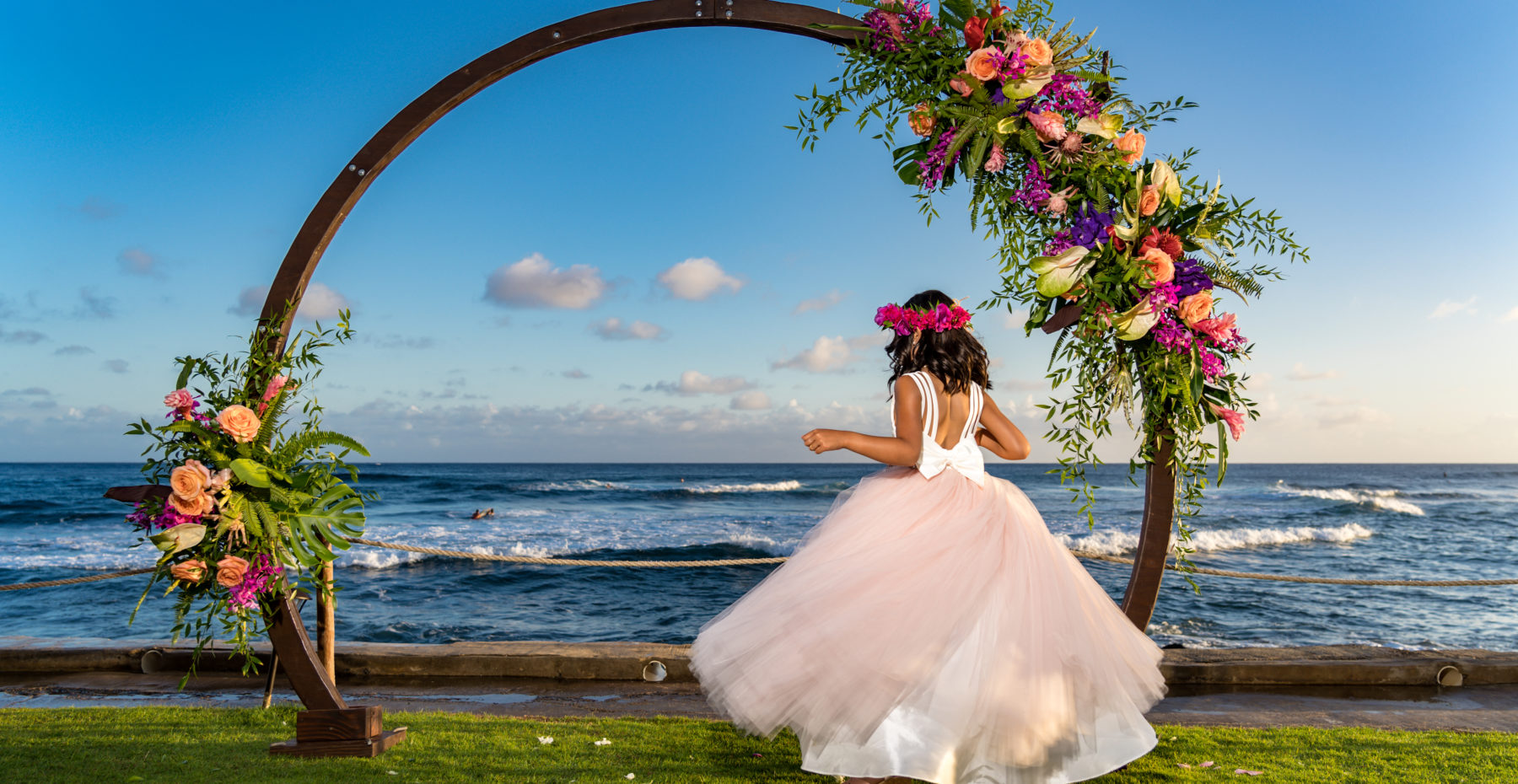 Kauai Flower girl and circle arch at an oceanfront private venue