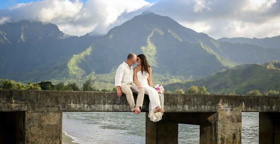 Romantic moment between the bride and groom after their elopement at Hanalei Bay