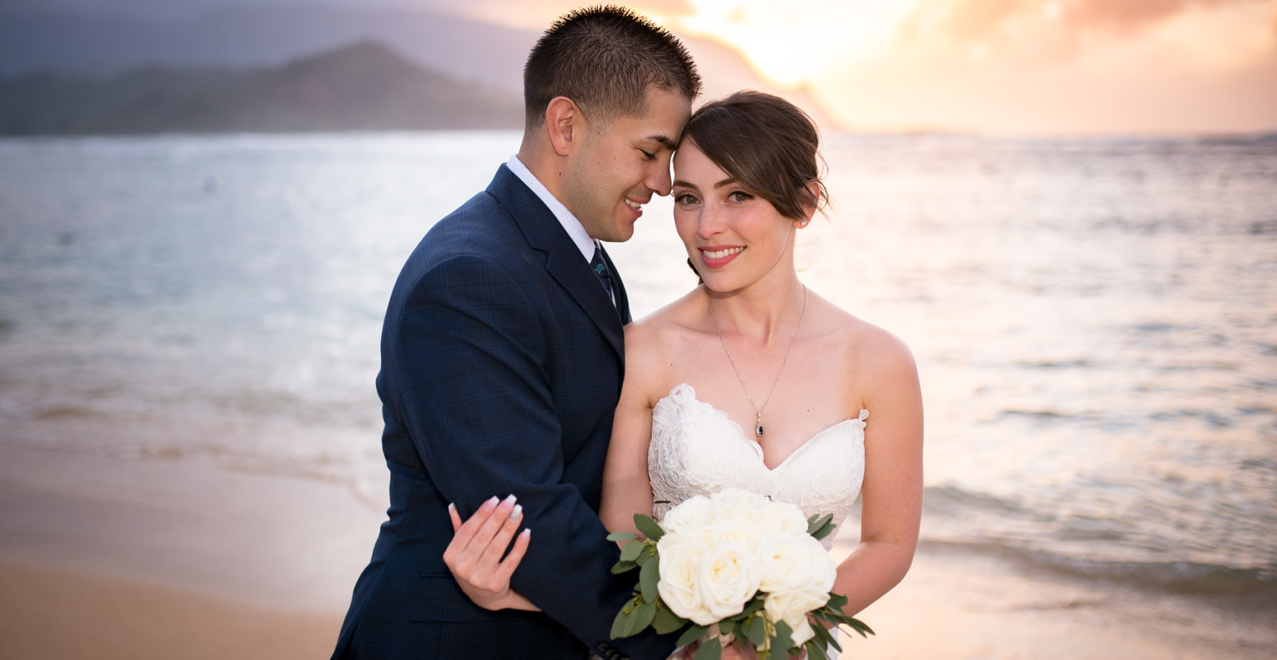 Just married couple at sunset in Princeville after elopement on Kauai